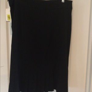 Black skirt, size 12 with pleated accents in back